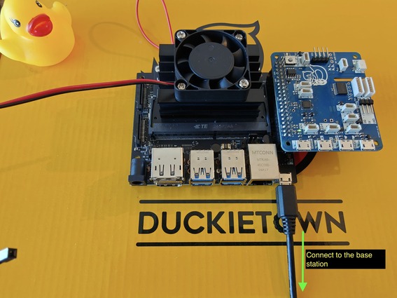 Connect the Jetson Nano dev kit to the base station through the micro-USB port